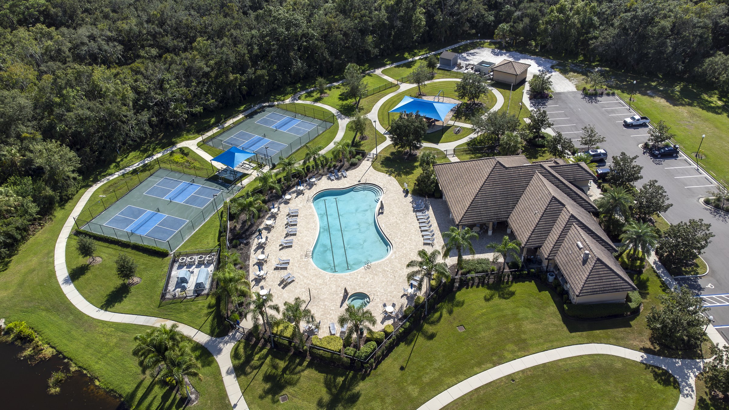 Aerial of community pool, tennis courts, and clubhouse — Sarasota drone photography